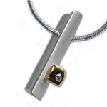 Silver, gold & diamond pendant